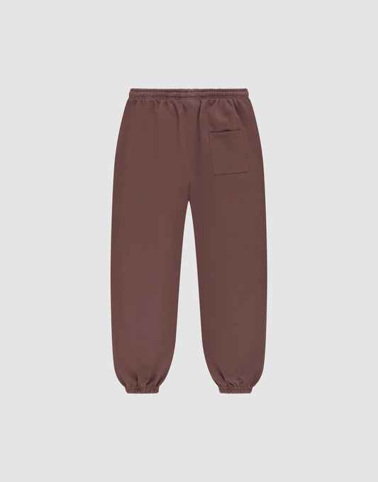 The LIVE FAST DIE YOUNG Wide Cuff Jogger features an elastic waistband, ankle cuffs, and a front right patch pocket, made from soft French Terry and shown against a plain light background.