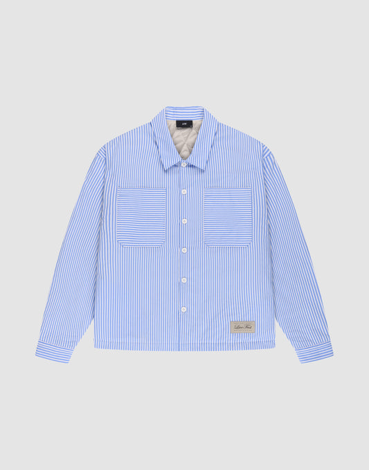 The LFDY Striped Padded Shirt by LIVE FAST DIE YOUNG features blue and white vertical stripes, an oversize fit, long sleeves, two front chest pockets, and a small rectangular label near the lower left hem. Displayed on a plain light background. | plain