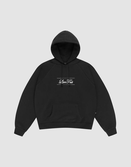 The LFDY Embroidery Hooded by LIVE FAST DIE YOUNG is a black regular fit hoodie made from 100% Baumwolle, featuring a front pocket and white Slice & Tea Originals print on the chest, shown on a plain light gray background. | plain