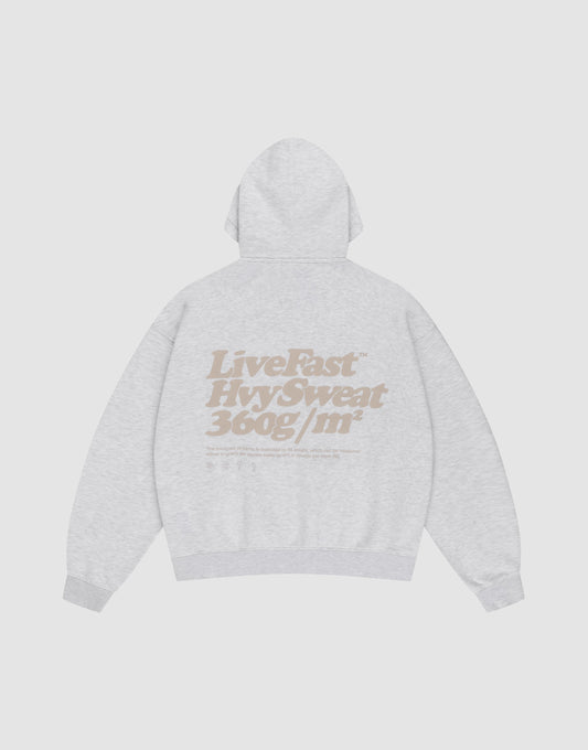 The Basic 360 Hooded by LIVE FAST DIE YOUNG is a light gray, oversized hoodie shown flat from the back. It features large beige front and back prints and is crafted from a high-quality cotton-polyester blend for comfort and style.
