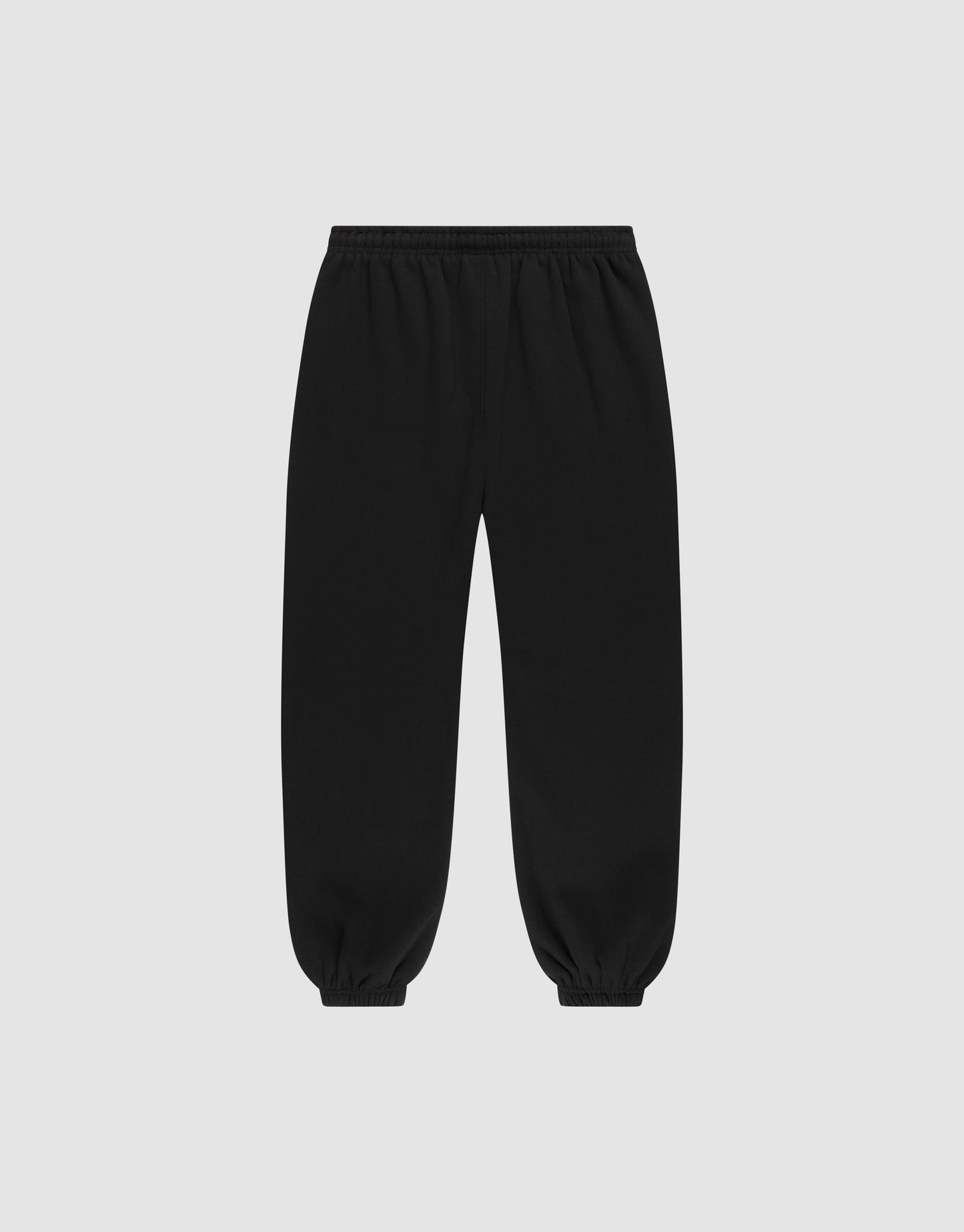 The LIVE FAST DIE YOUNG Basic Loose Jogger in black features a relaxed fit, Elastik-Bund waistband, and elastic ankle cuffs, shown laid flat on a light gray background.