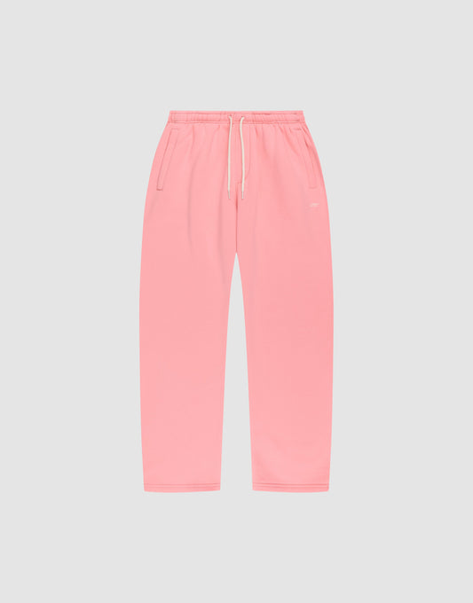 The Basic Wide Jogger by LIVE FAST DIE YOUNG features an oversized fit, elastic waistband, white drawstring, and side pockets, shown in pink laid flat on a light gray background. | plain