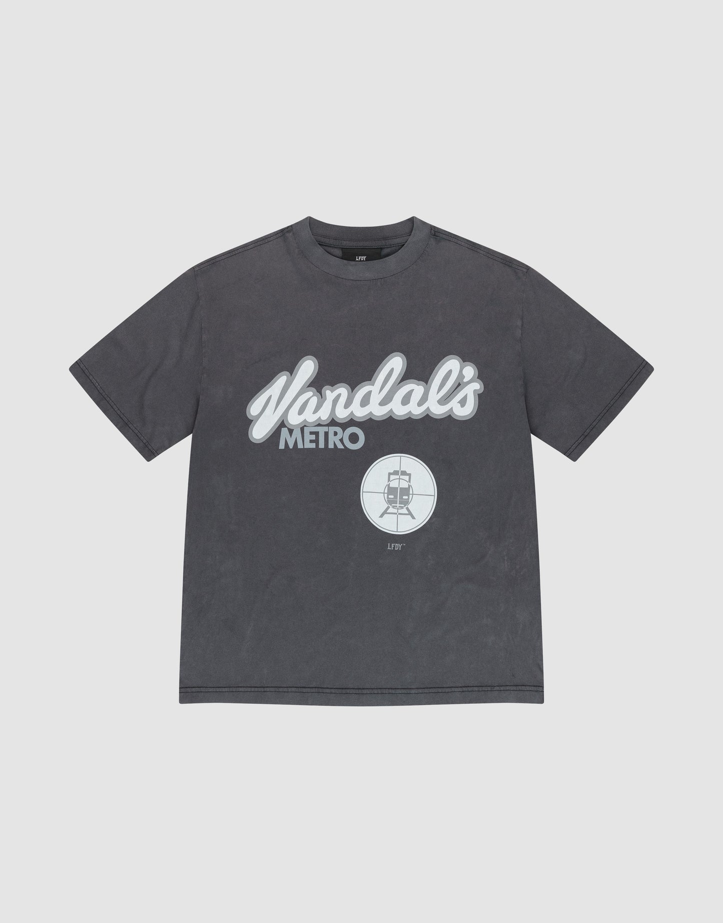 The LFDY Vandals Tee by LIVE FAST DIE YOUNG is a black Oversize Fit t-shirt with "Vandals METRO" in white cursive and block letters, a bold front print, and a small circular subway train graphic above it.