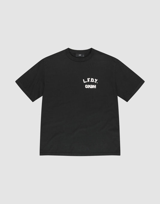 The LFDY District Tee by LIVE FAST DIE YOUNG is a black regular fit short-sleeve t-shirt made from 100% cotton. It features bold white L.F.D.Y. GYM text in a distressed font on the left chest and is shown laid flat on a light gray background. | plain