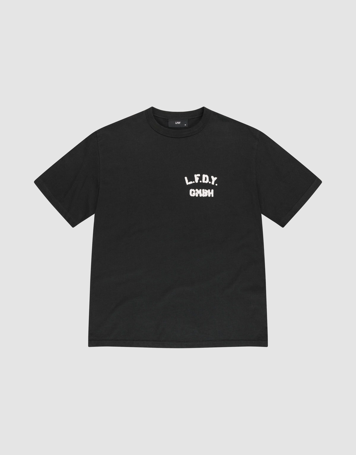 The LFDY District Tee by LIVE FAST DIE YOUNG is a black regular fit short-sleeve t-shirt made from 100% cotton. It features bold white L.F.D.Y. GYM text in a distressed font on the left chest and is shown laid flat on a light gray background. | plain