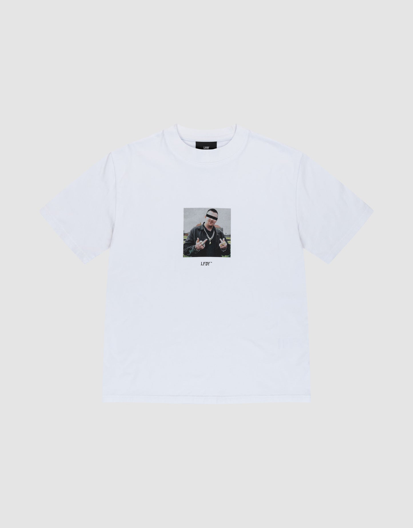 The LFDY Gambling Tee by LIVE FAST DIE YOUNG is a white regular fit t-shirt with a bold front print of a person making hand signs, sunglasses, and beanie. "LITTY" is printed below. Made from 100% Baumwolle. Displayed on a plain light background.