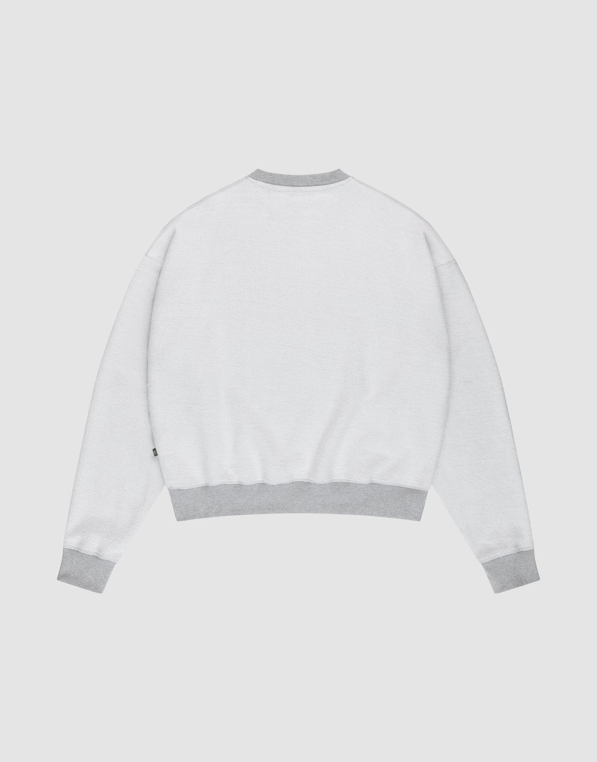 The LFDY District Sweater by LIVE FAST DIE YOUNG is shown from the back in an oversize fit, with light gray ribbed cuffs, waistband, and collar, displayed against a plain white background.