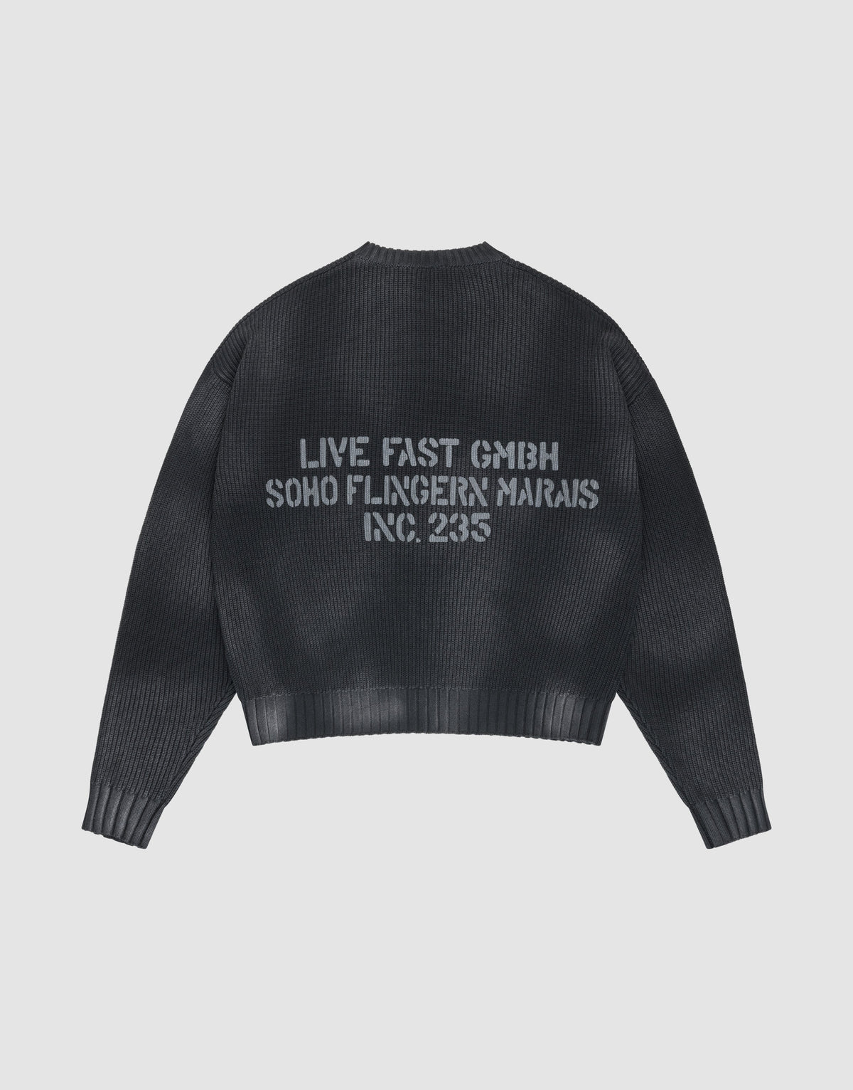 The LFDY Washed Knit Sweater by LIVE FAST DIE YOUNG is black, ribbed, and oversized, with a gray backprint. Made from 100% Baumwolle, it’s shown laid flat on a light gray background. | plain