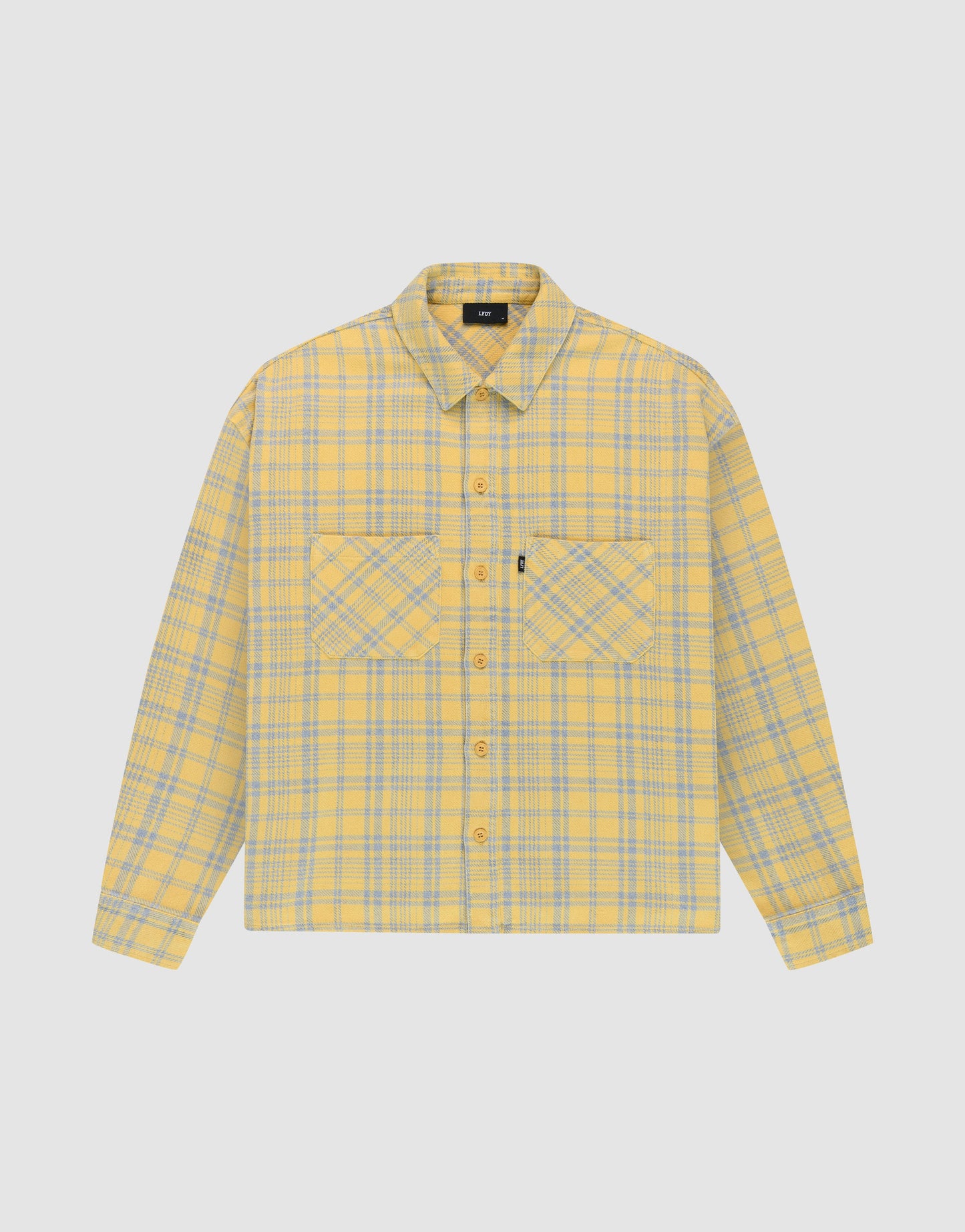 The LIVE FAST DIE YOUNG Vintage Flannel is a yellow and gray plaid oversize long-sleeve button-up shirt with two chest pockets featuring diagonal plaid, a collar, and is shown on a plain white background. | plain