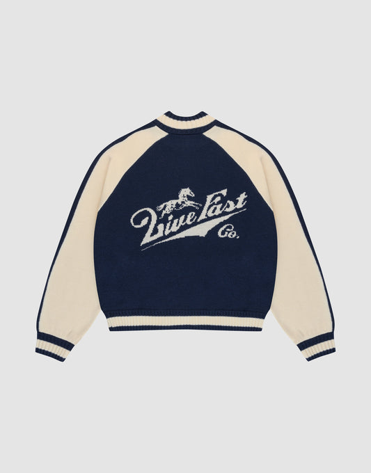 A navy blue and cream Boxy Knit Zip Jacket by LIVE FAST DIE YOUNG, with oversized fit, long raglan sleeves, and a large intarsia-knit running horse graphic above "Live Fast Co." script on the back. | plain