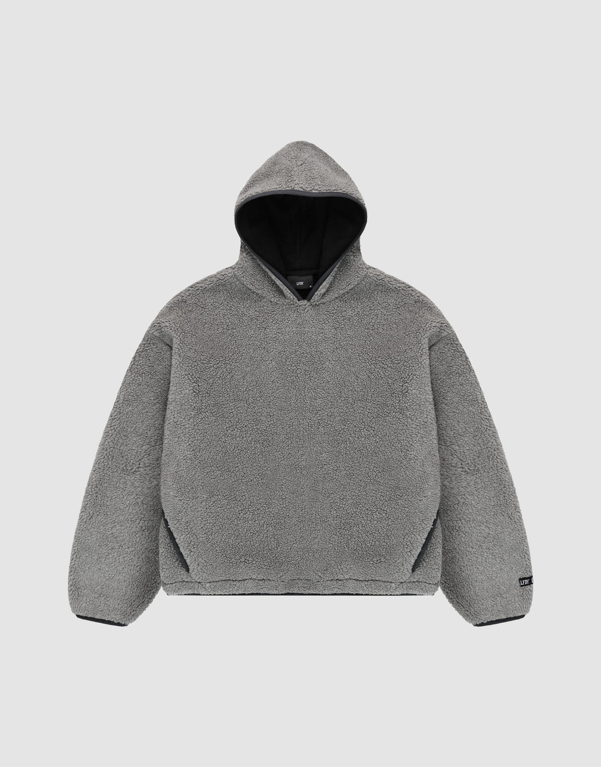 The LFDY Teddy Hooded by LIVE FAST DIE YOUNG is a gray, long-sleeve, oversized hoodie with soft fleece-like material and practical pockets, shown flat on a light gray background. | plain