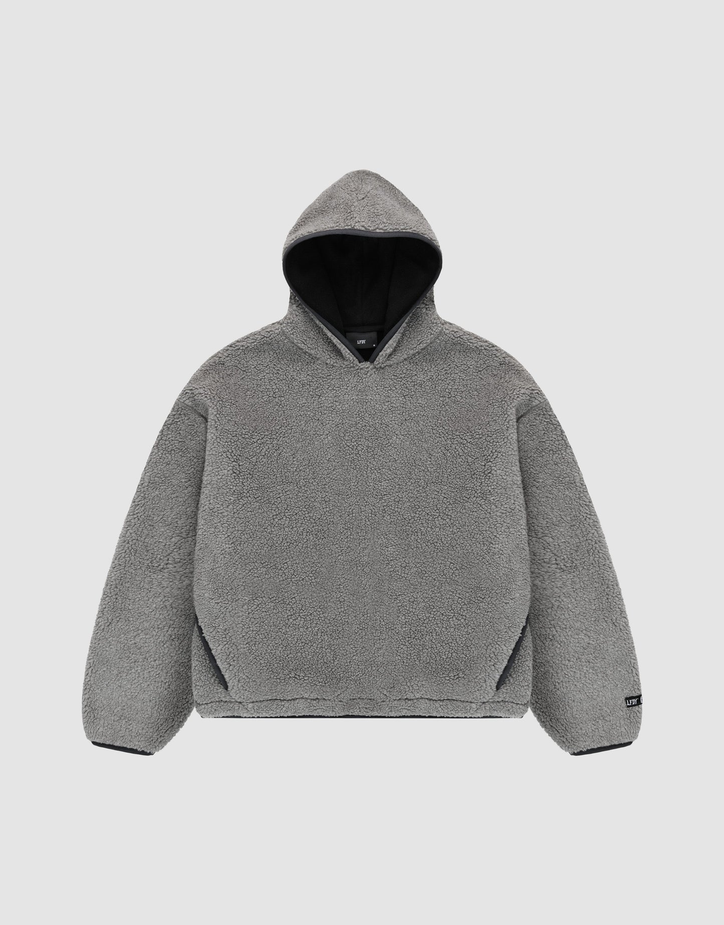 The LFDY Teddy Hooded by LIVE FAST DIE YOUNG is a gray, long-sleeve, oversized hoodie with soft fleece-like material and practical pockets, shown flat on a light gray background. | plain