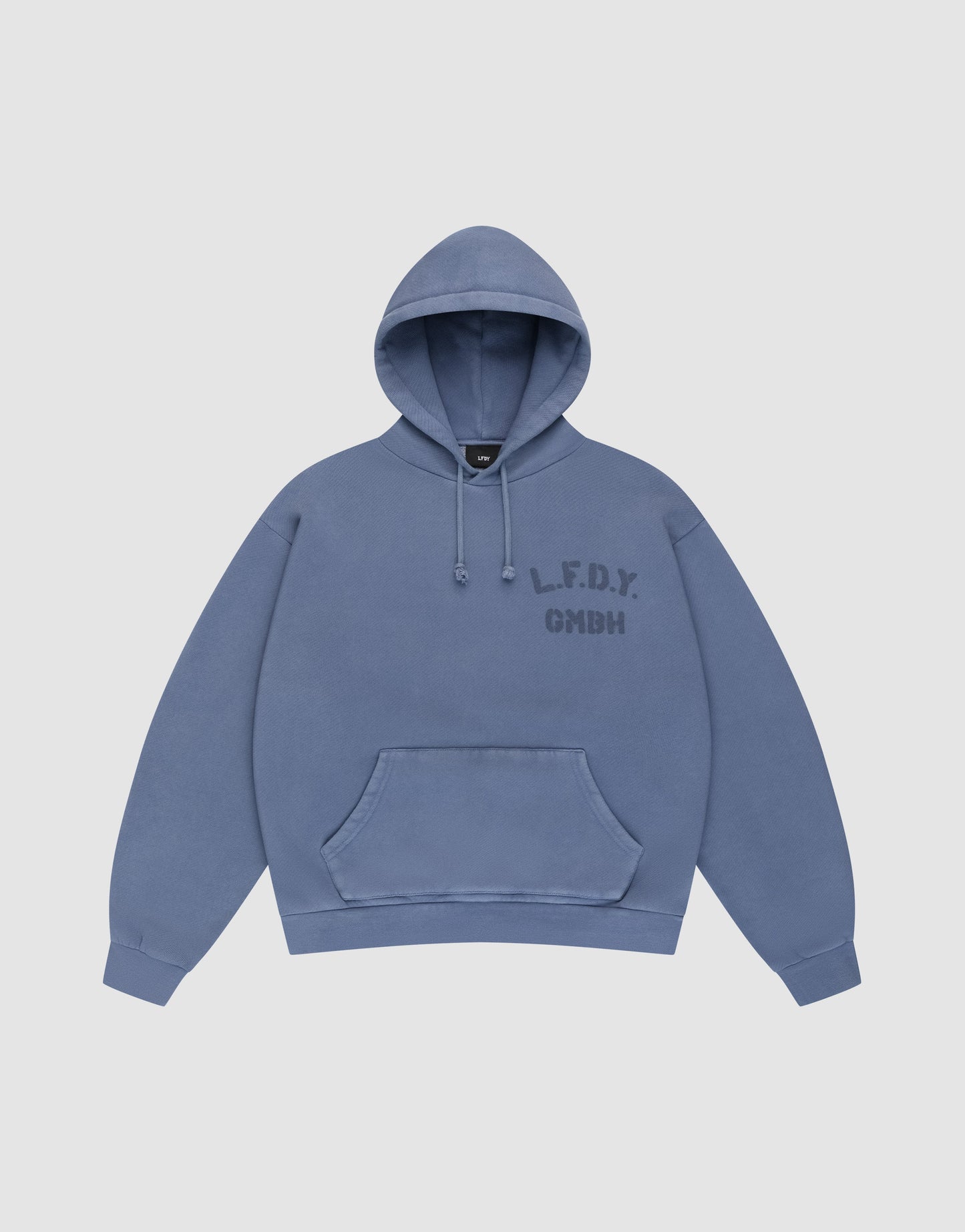 A blue LFDY GmbH Hooded hoodie by LIVE FAST DIE YOUNG with an oversize fit, drawstring hood, front pocket, and “L.F.D.Y. GMBH” in dark blue on the left chest. Displayed flat on a plain light background for a clean look.