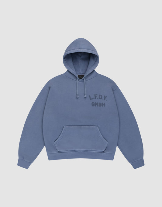 A blue LFDY GmbH Hooded hoodie by LIVE FAST DIE YOUNG with an oversize fit, drawstring hood, front pocket, and “L.F.D.Y. GMBH” in dark blue on the left chest. Displayed flat on a plain light background for a clean look. | plain