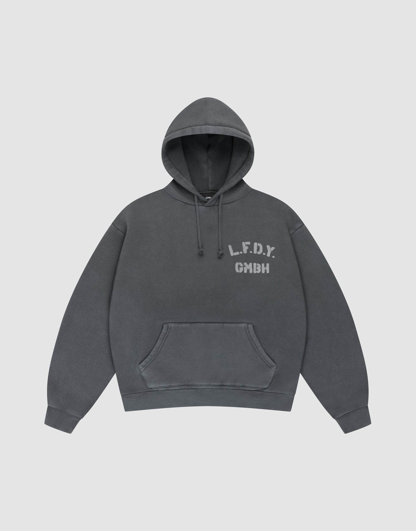 The LIVE FAST DIE YOUNG LFDY GmbH Hooded is a dark gray oversize-fit hoodie with drawstring hood and front pocket, featuring white "L.F.D.Y. GMBH" print on the left chest and subtle vintage wash, shown flat on a light gray background. | plain