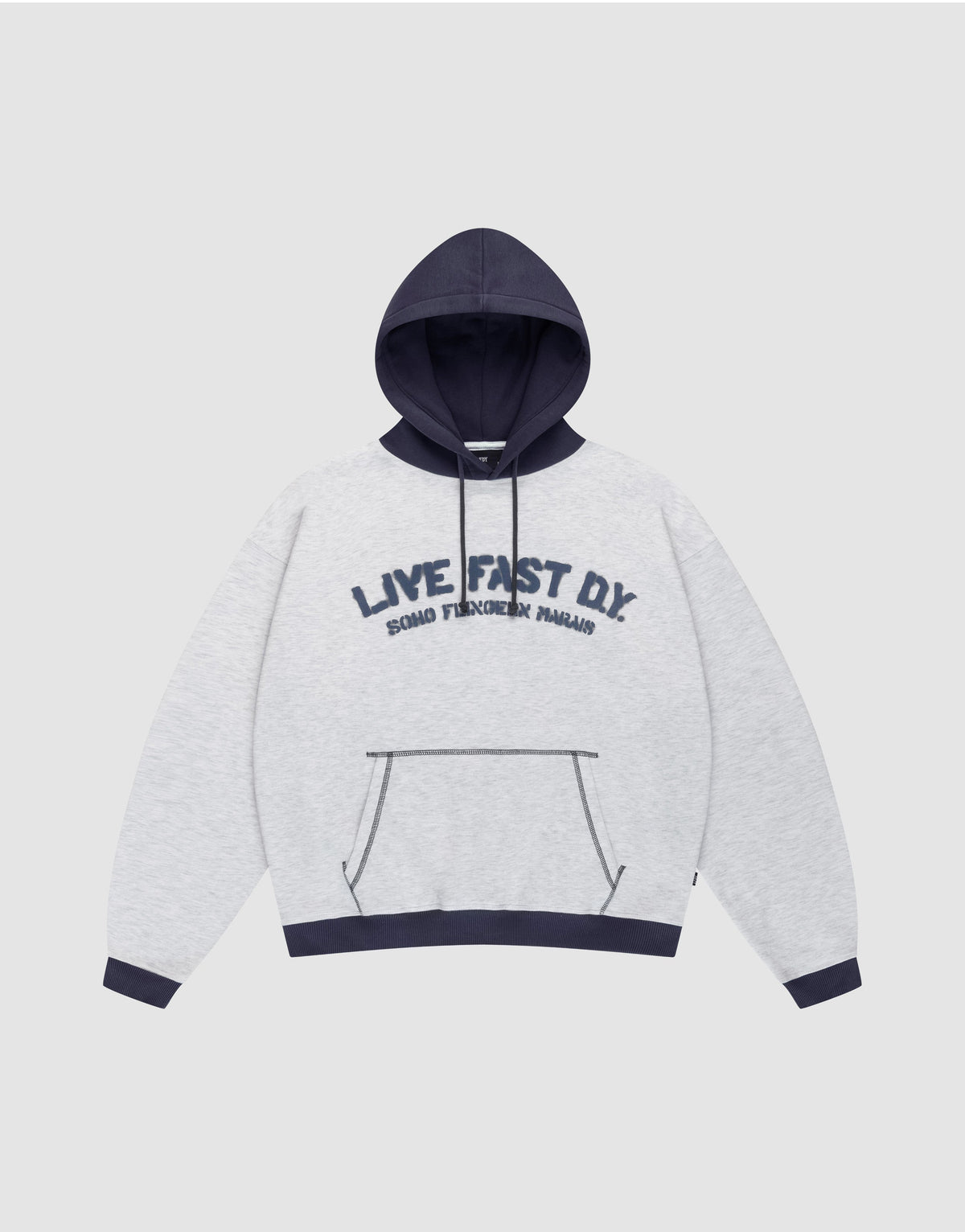The LFDY District Hooded by LIVE FAST DIE YOUNG features a light gray oversize fit, dark blue contrast hood, cuffs, and hem. Front print: "LIVE FAST D.I.Y." with "BOARD FINGERS PALMS" below. Includes a kangaroo pocket. | plain