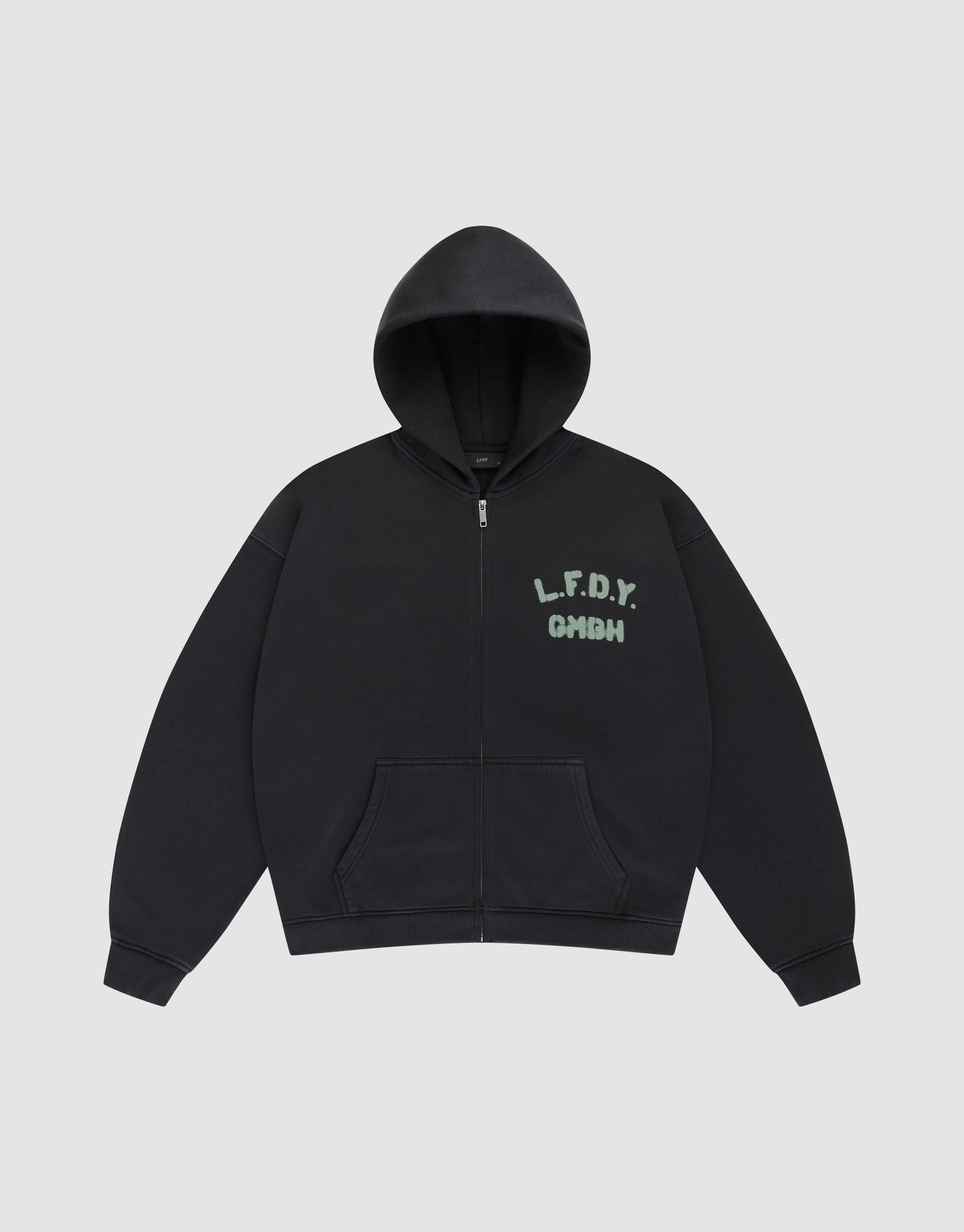 The Live Fast District Hooded Zip by LIVE FAST DIE YOUNG is a black oversized zip-up hoodie with a hood, front pockets, and green "L.F.D.Y. GMGH" text on the left chest.