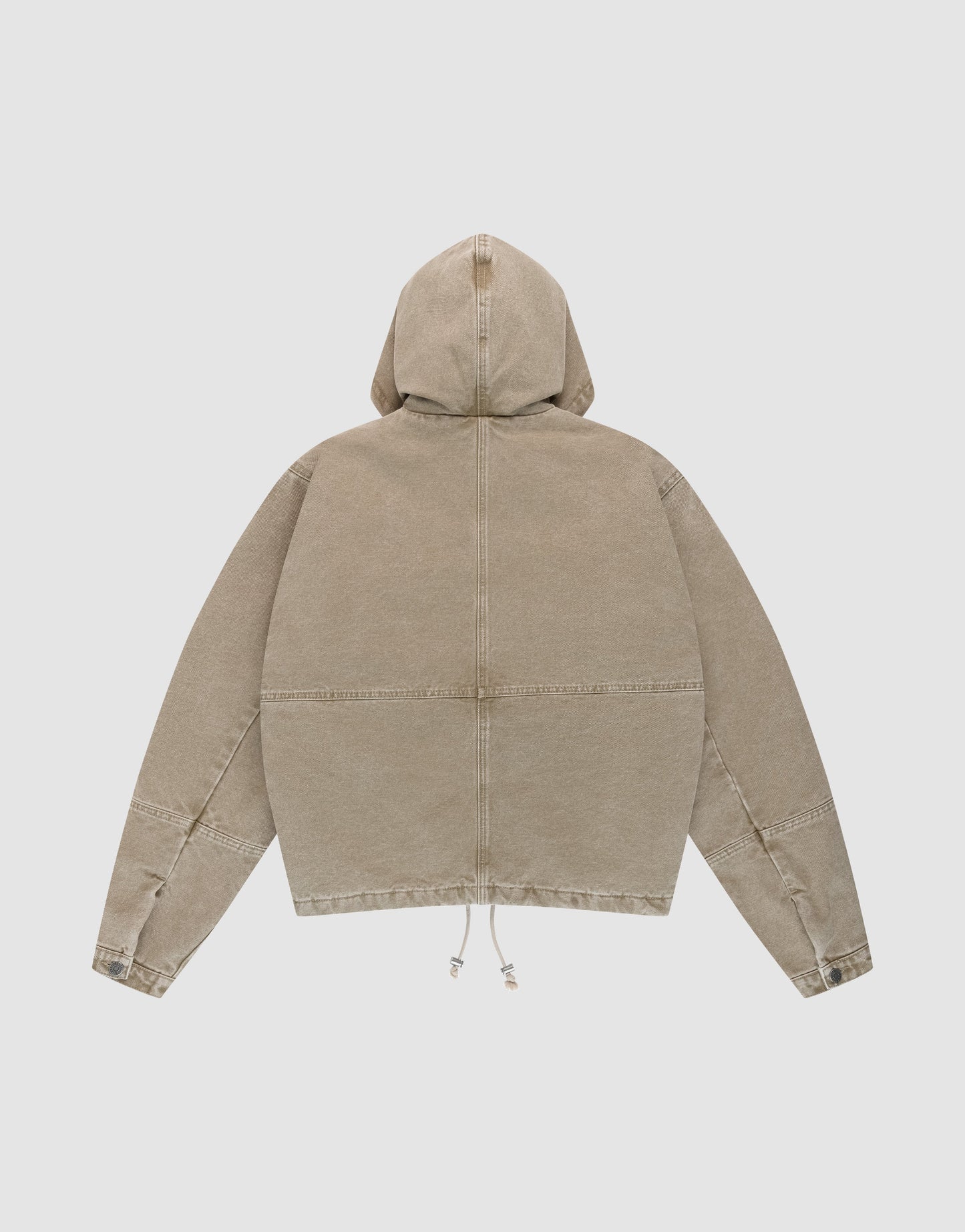 The LIVE FAST DIE YOUNG Faded Workwear Jacket in tan cotton is laid flat with the back up. This oversized vintage jacket features a hood, hem drawstrings, and visible seam details on the back and sleeves.