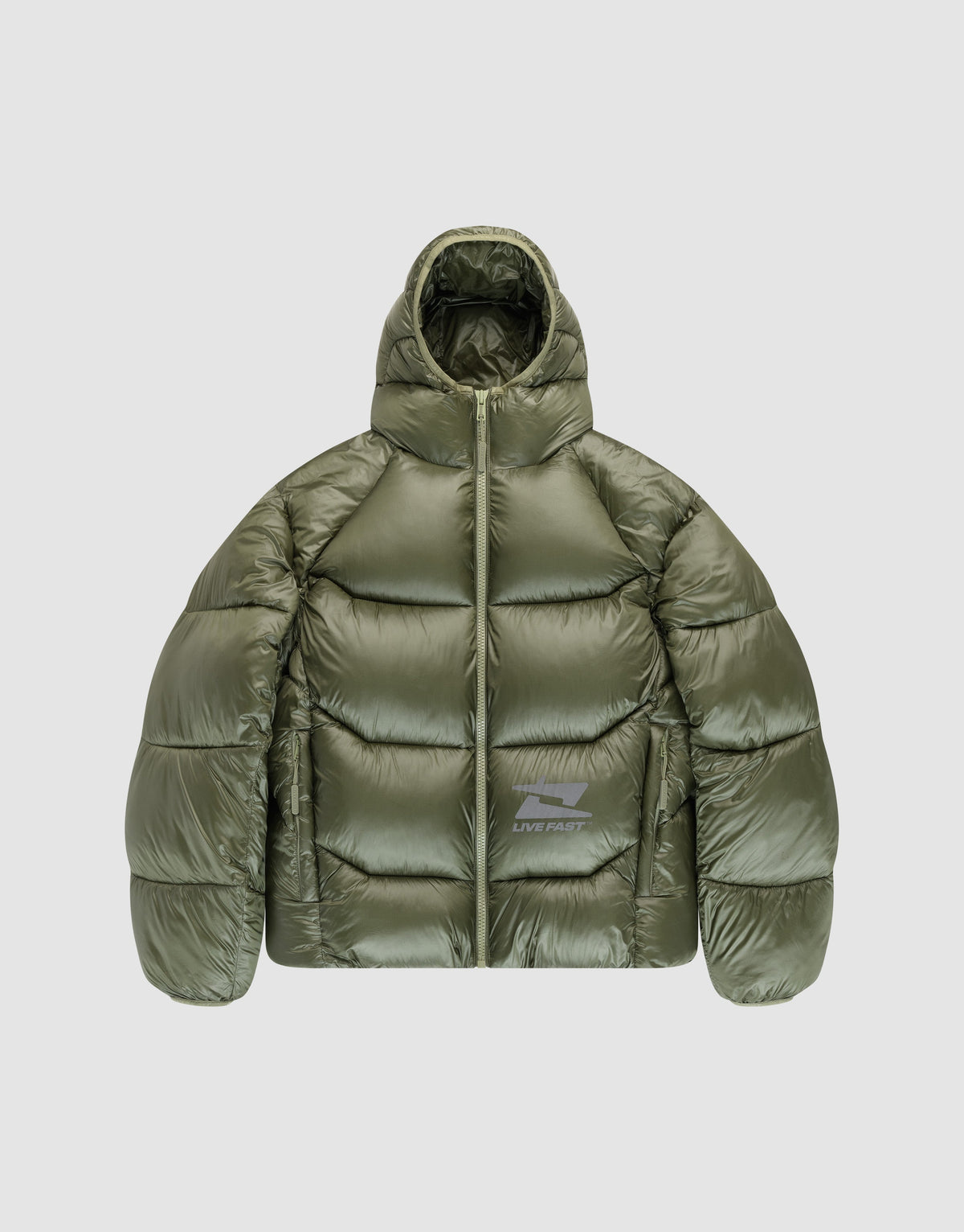 The Live Fast Puffer Jacket by LIVE FAST DIE YOUNG is an olive green, shiny nylon jacket with an oversized fit, hood, front zipper, large horizontal quilting, and a small white "LIVE FAST" logo on the lower left front. Displayed on light gray. | plain