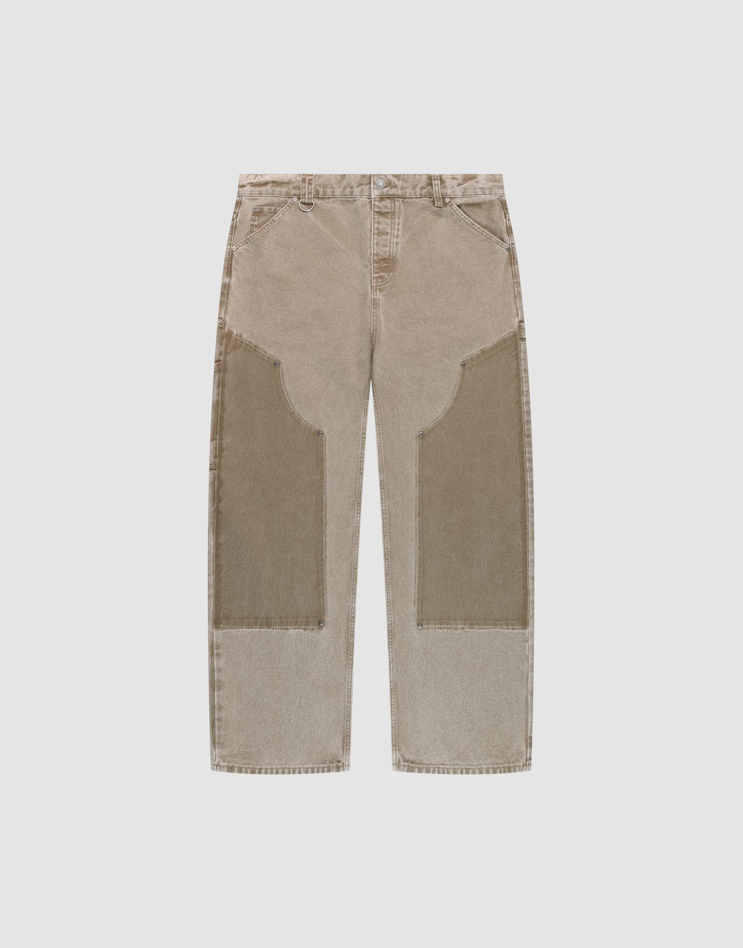The LIVE FAST DIE YOUNG Faded Carpenter Pants are beige, straight-leg, baggy-fit jeans with large darker beige patches on the front thigh and knee, featuring front pockets and belt loops, displayed flat on a light background. | plain