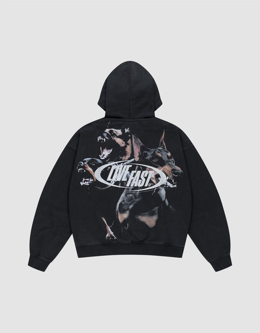 The LFDY Canine Hooded Zip by LIVE FAST DIE YOUNG is a black oversize fit hoodie with a snarling Doberman graphic and bold silver "LIVE FAST" print across the back, displayed flat on a light gray background. | plain