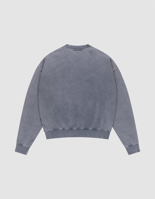 The LIVE FAST DIE YOUNG Basic Blank Sweater, a faded blue, long-sleeve crewneck with Vintage-Waschung, is shown laid flat with the back facing up on a light gray background.