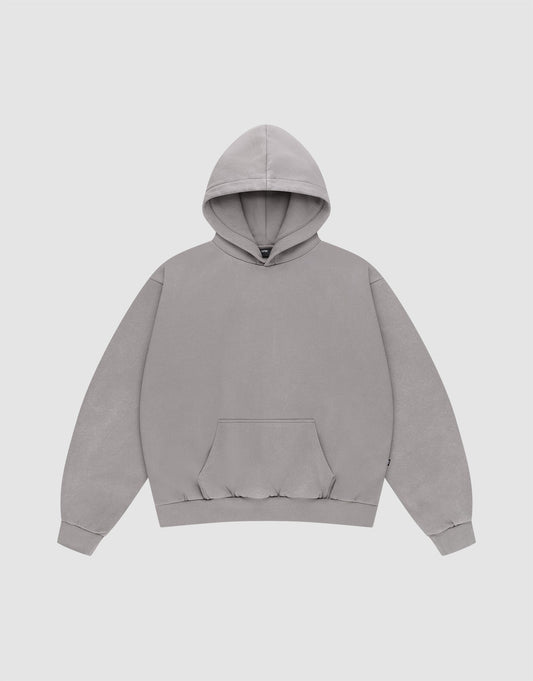 The Basic Blank Hooded by LIVE FAST DIE YOUNG is a plain, light gray Oversize Fit sweatshirt made from soft Baumwolle, with a front pocket and ribbed cuffs and waistband, shown against a white background.