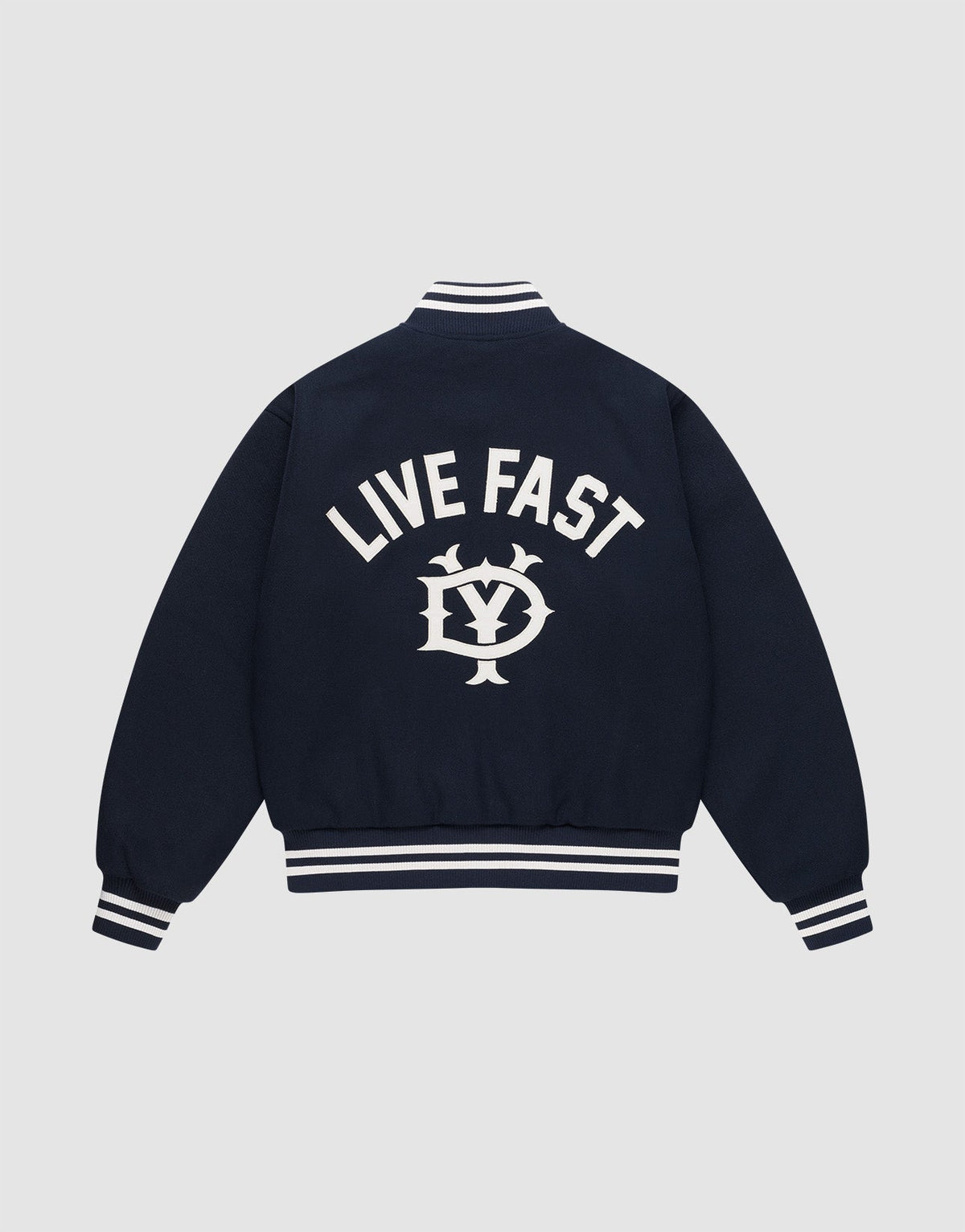 The Live Fast College Jacket by LIVE FAST DIE YOUNG is a navy varsity jacket with white striped cuffs, collar, and hem. The back features bold "LIVE FAST" Rückenstick text above an LV circular emblem. Regular fit for comfort and style. | plain