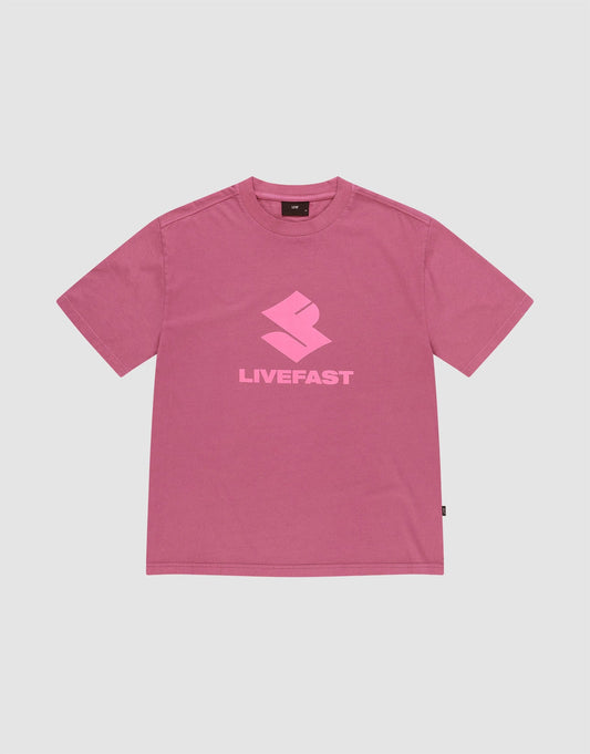 The LIVE FAST DIE YOUNG Live Fast LF Tee is a pink oversized short-sleeve t-shirt with a light pink geometric "LIVEFAST" logo, crafted from 100% Baumwolle, shown on a plain light gray background.