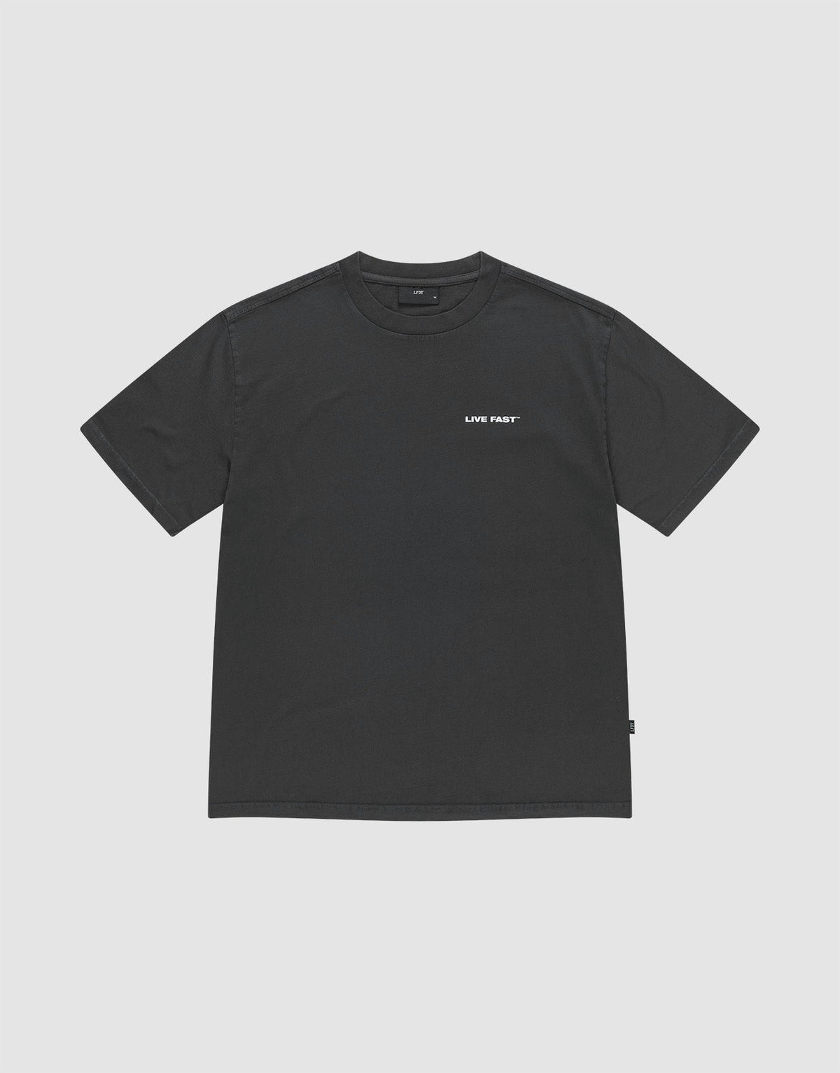 The LFDY Grand Theft Tee by LIVE FAST DIE YOUNG is a black, 100% Baumwolle oversize-fit short-sleeve shirt with "LIVE FAST" in small white letters on the left chest, shown against a light grey background.