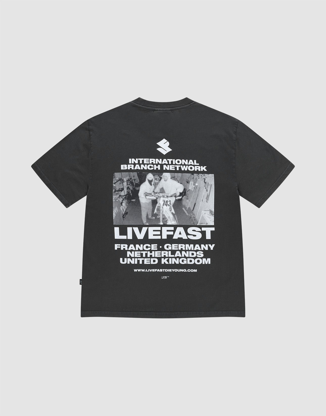 The LFDY Grand Theft Tee by LIVE FAST DIE YOUNG is an oversized black T-shirt made from 100% cotton, featuring bold front and back prints of runners, “INTERNATIONAL BRANCH NETWORK,” “LIVEFAST,” and country names.
