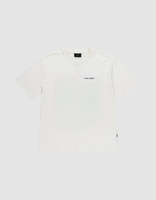 The LFDY Grand Theft Tee by LIVE FAST DIE YOUNG is a plain white oversized 100% Baumwolle short-sleeve t-shirt with a small black "LIVE FAST" text on the left chest, shown against a light grey background.