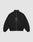 The LFDY Dealership Trackjacket by LIVE FAST DIE YOUNG is a black zip-up with Stehkragen, subtle LIVE FAST text and logo on the front, red sleeve logos near the cuffs, and a vergoldeter Reißverschluss. Background: light gray.