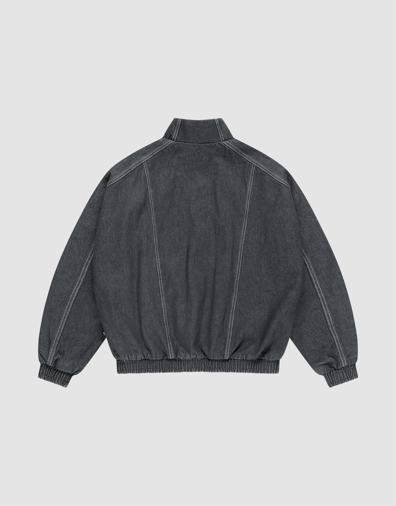 The LFDY Denim Trackjacket by LIVE FAST DIE YOUNG is a dark gray 100% Baumwolle jacket, shown from the back with prominent white stitching, Stehkragen, and elasticated cuffs and waistband.