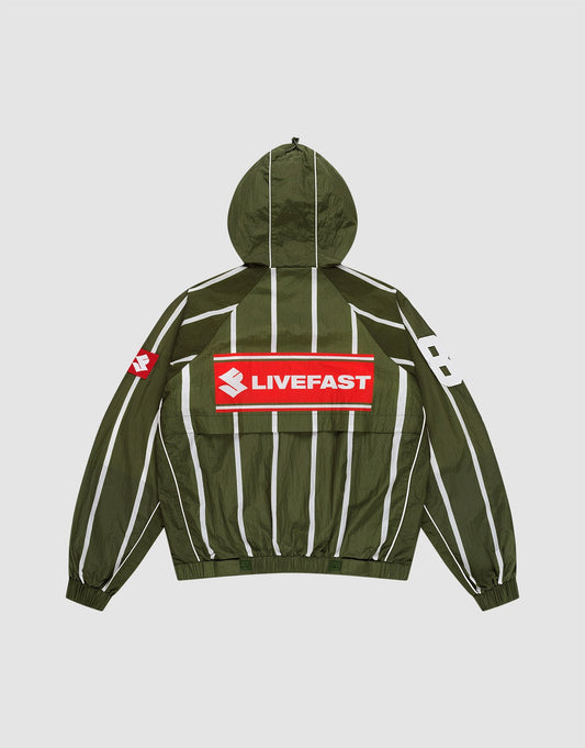 The LFDY Nylon Trackjacket by LIVE FAST DIE YOUNG is a green oversized jacket with a hood featuring an elastic drawstring, white vertical stripes, a bold red and white LIVEFAST backprint, "82" on the right sleeve, and a small red logo on the left. | plain