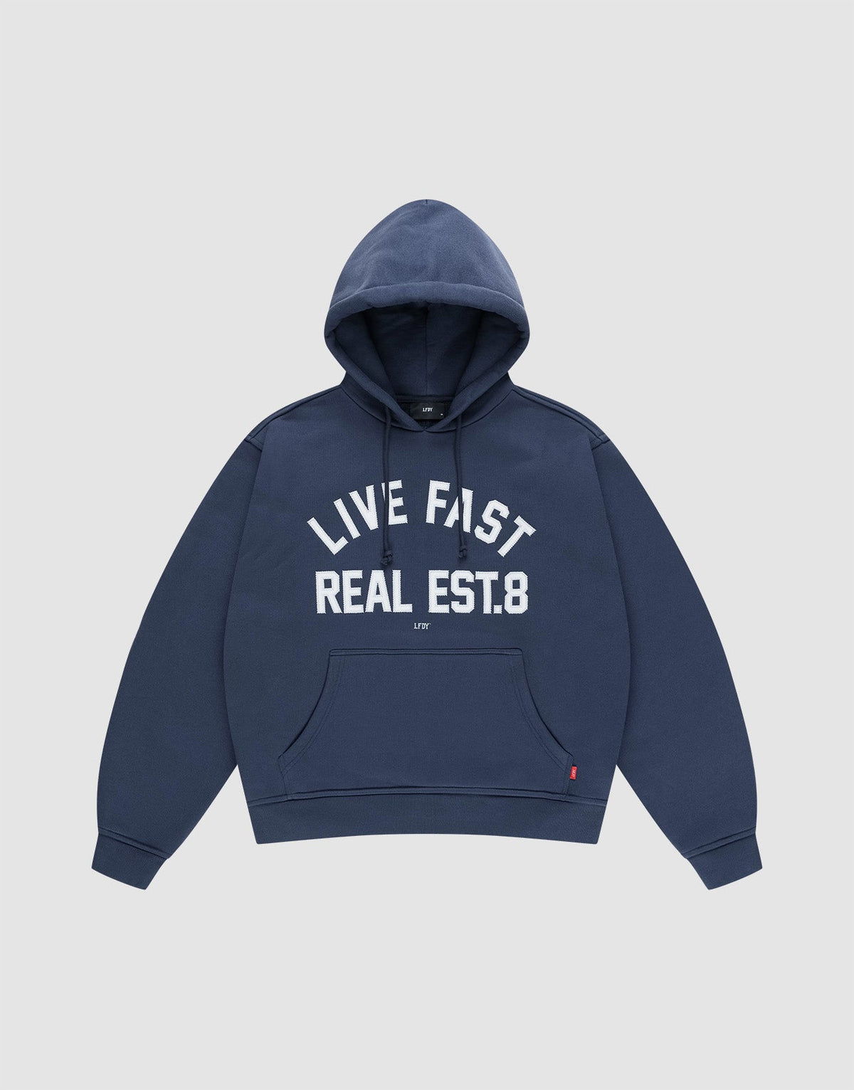 The LFDY Heavyweight Lounge Hooded by LIVE FAST DIE YOUNG is a navy blue regular-fit hoodie made from 100% Baumwolle, featuring a front pocket and "LIVE FAST REAL EST.8" in bold white letters across the chest. | plain