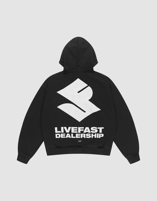 The LFDY Dealership Hooded by LIVE FAST DIE YOUNG is an oversized black hoodie with a large white S logo and bold LIVEFAST DEALERSHIP text on the back. Made from soft Baumwolle, it features striking prints on both front and back. | plain