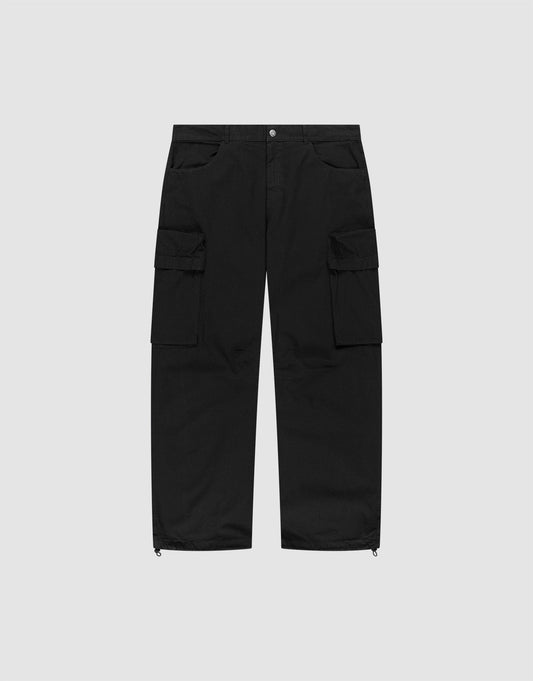 The LFDY Baggy Cargo by LIVE FAST DIE YOUNG features a baggy fit, 100% cotton build, multiple side cargo pockets, button and zip closure, and adjustable cuff drawstrings, shown flat on a light gray background. | plain