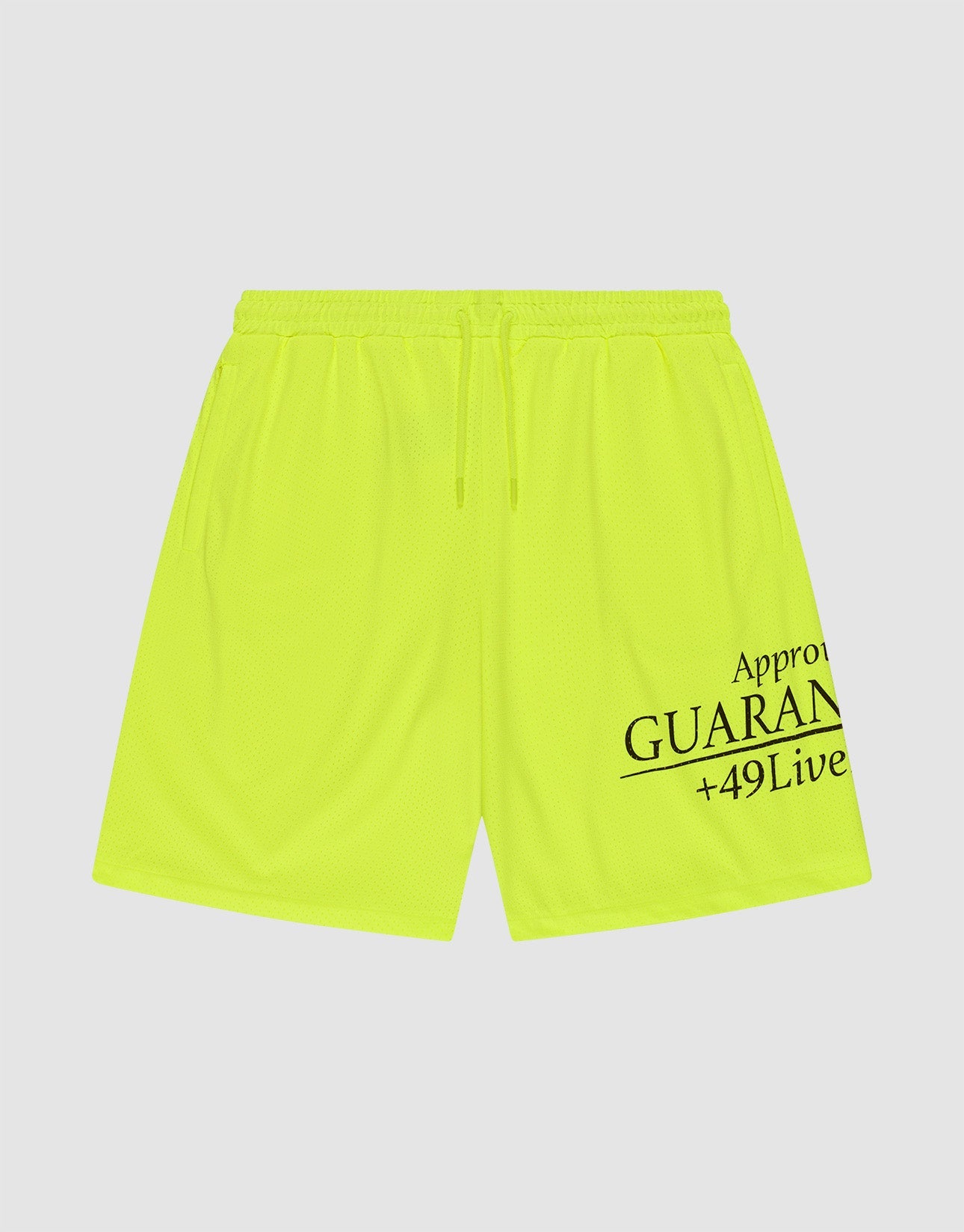 The LFDY Guaranteed Mesh Shorts by LIVE FAST DIE YOUNG are neon yellow polyester athletic shorts with an elastic waistband, drawstring, and black "Approv GUARAN +49Live" text on the lower right leg. Wide fit shown on a white background.