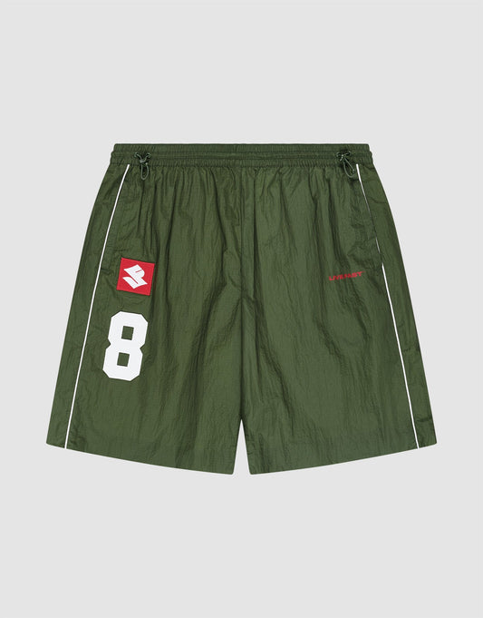 The LFDY Nylon Trackshorts by LIVE FAST DIE YOUNG feature a wide fit, elastic waistband, green polyamid fabric, white piping, number 8 and logo patch, plus bold red "LIBERTY" text on the right leg for sporty style and active comfort. | plain