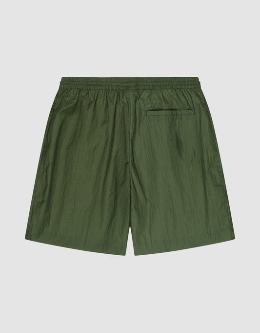 LFDY Nylon Trackshorts by LIVE FAST DIE YOUNG in olive green feature a wide fit, elastic waistband, single back pocket, and subtle logo print, shown laid flat on a plain light background.