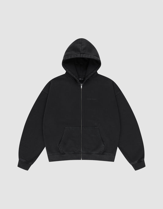 The LFDY Grand Theft Hooded Zip by LIVE FAST DIE YOUNG is a plain black zip-up hoodie with soft Baumwolle, a front zipper, hood, two pockets, and long sleeves, shown against a light gray background.
