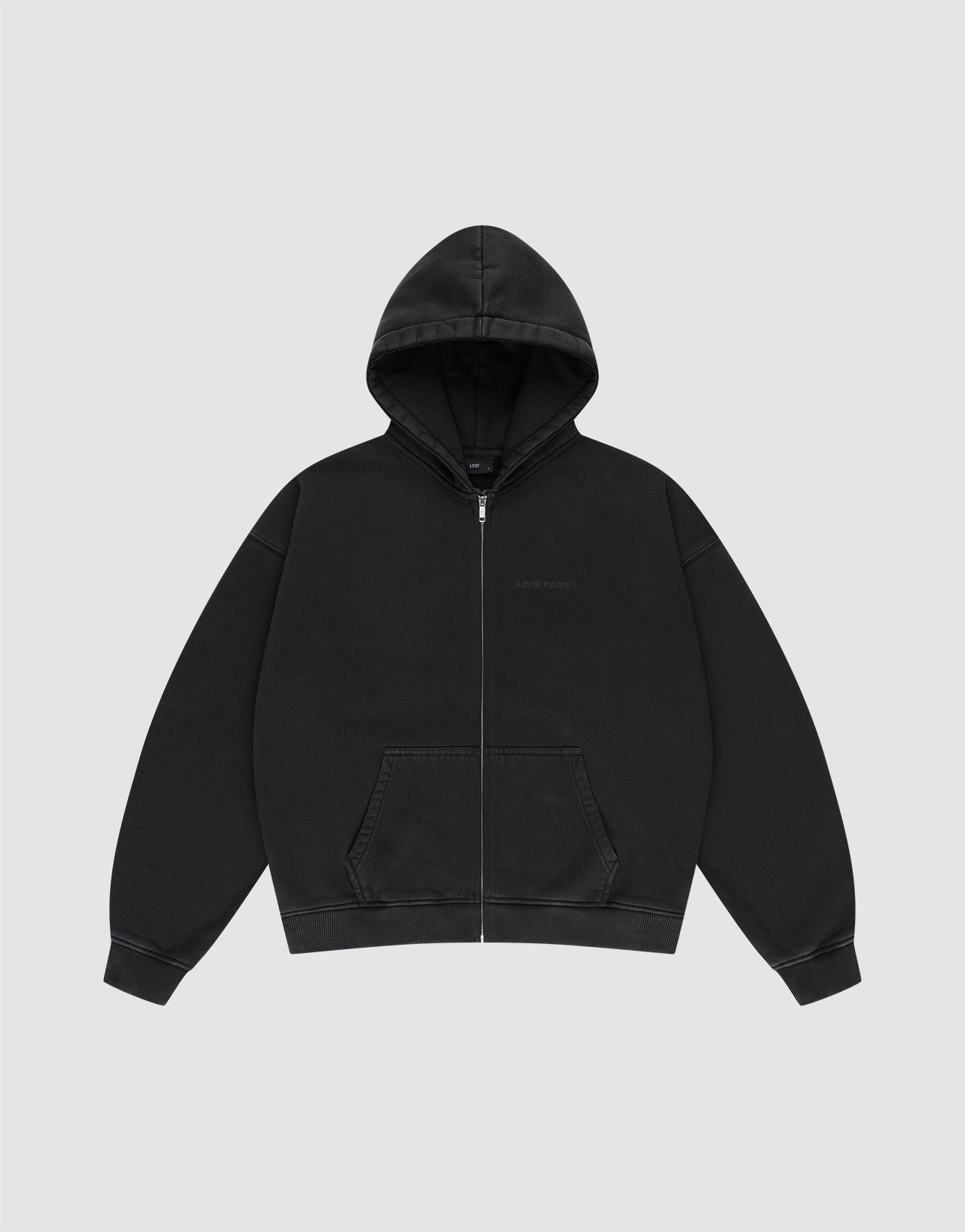 The LFDY Grand Theft Hooded Zip by LIVE FAST DIE YOUNG is a plain black zip-up hoodie with soft Baumwolle, a front zipper, hood, two pockets, and long sleeves, shown against a light gray background.