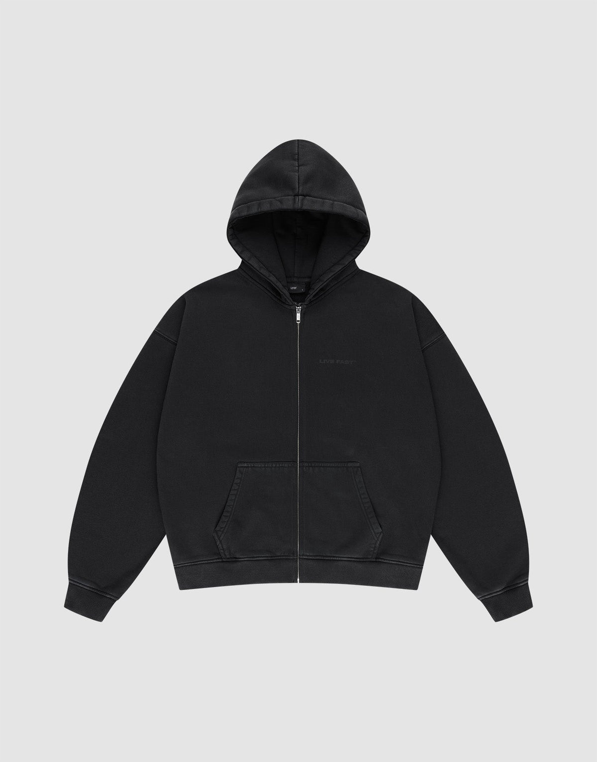 The LFDY Grand Theft Hooded Zip by LIVE FAST DIE YOUNG is a plain black zip-up hoodie with soft Baumwolle, a front zipper, hood, two pockets, and long sleeves, shown against a light gray background.
