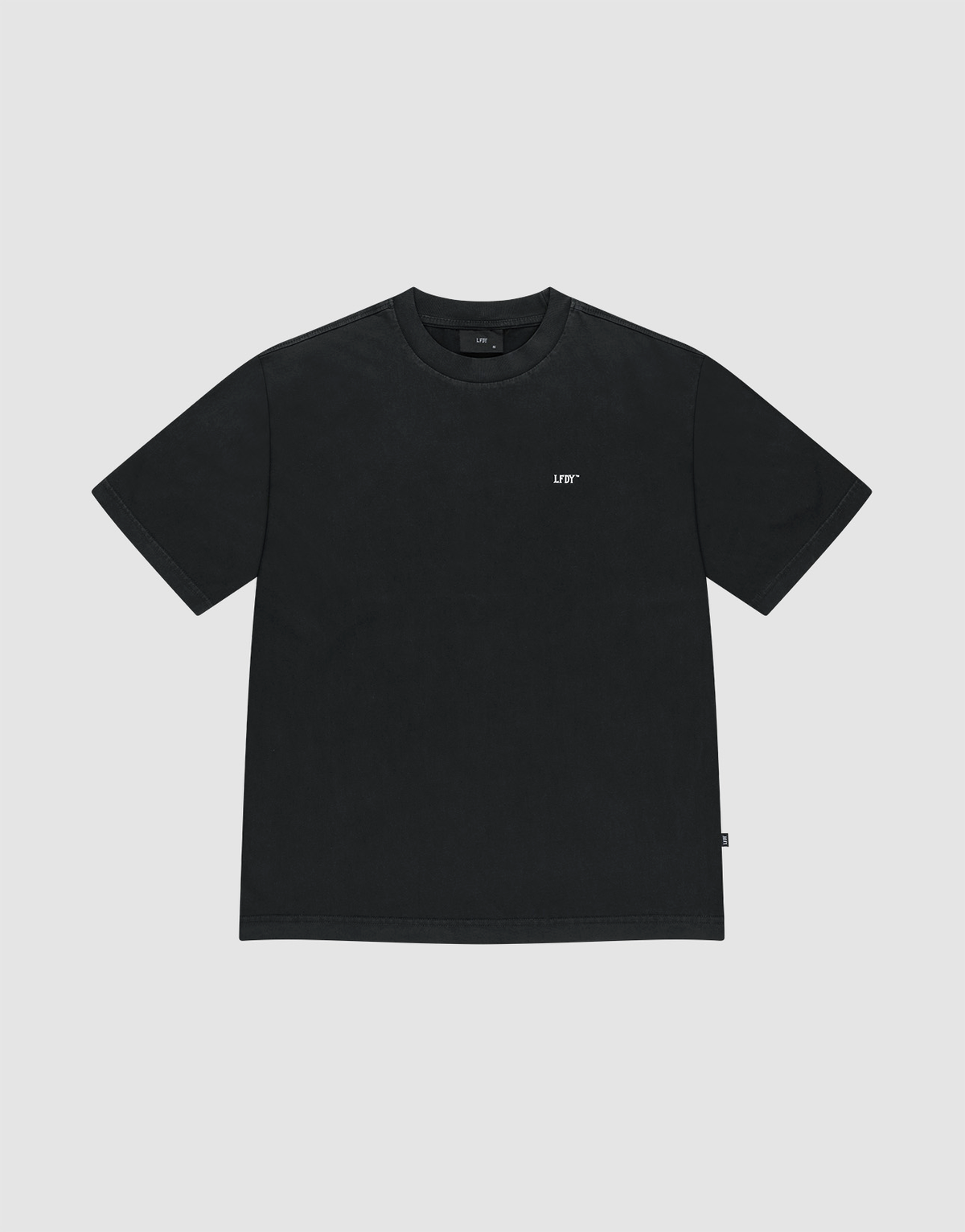The Basic Evidence Tee by LIVE FAST DIE YOUNG is a plain black, oversize fit short-sleeve t-shirt with a small white "LUV" text on the left chest, shown against a light gray background.