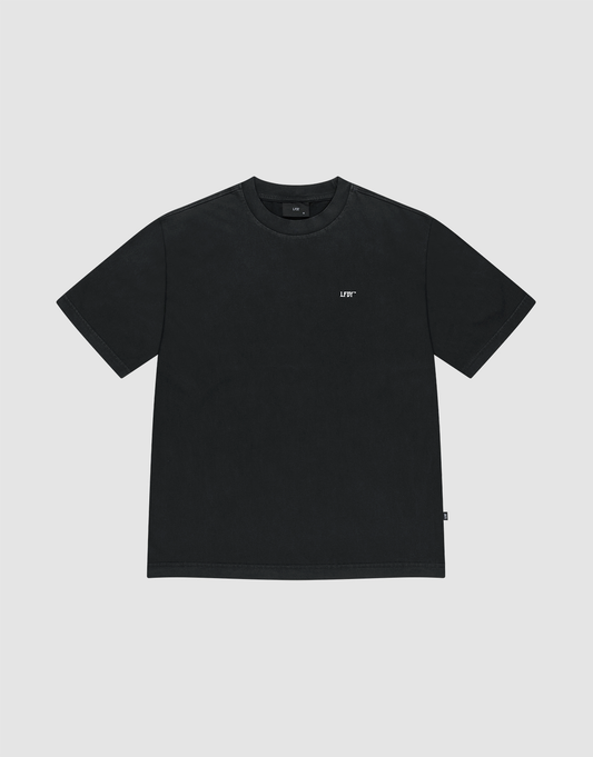 The Basic Evidence Tee by LIVE FAST DIE YOUNG is a plain black, oversize fit short-sleeve t-shirt with a small white "LUV" text on the left chest, shown against a light gray background.