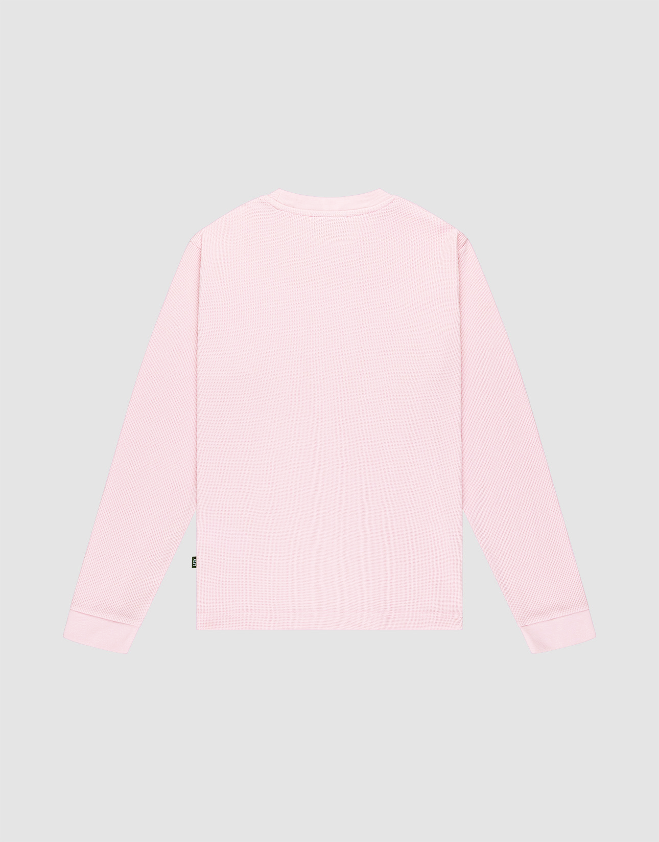 The Basic Waffle Longsleeve by LIVE FAST DIE YOUNG is a light pink, oversize fit shirt made from soft Baumwolle Polyester, shown flat from the back against a plain gray background with no visible patterns.