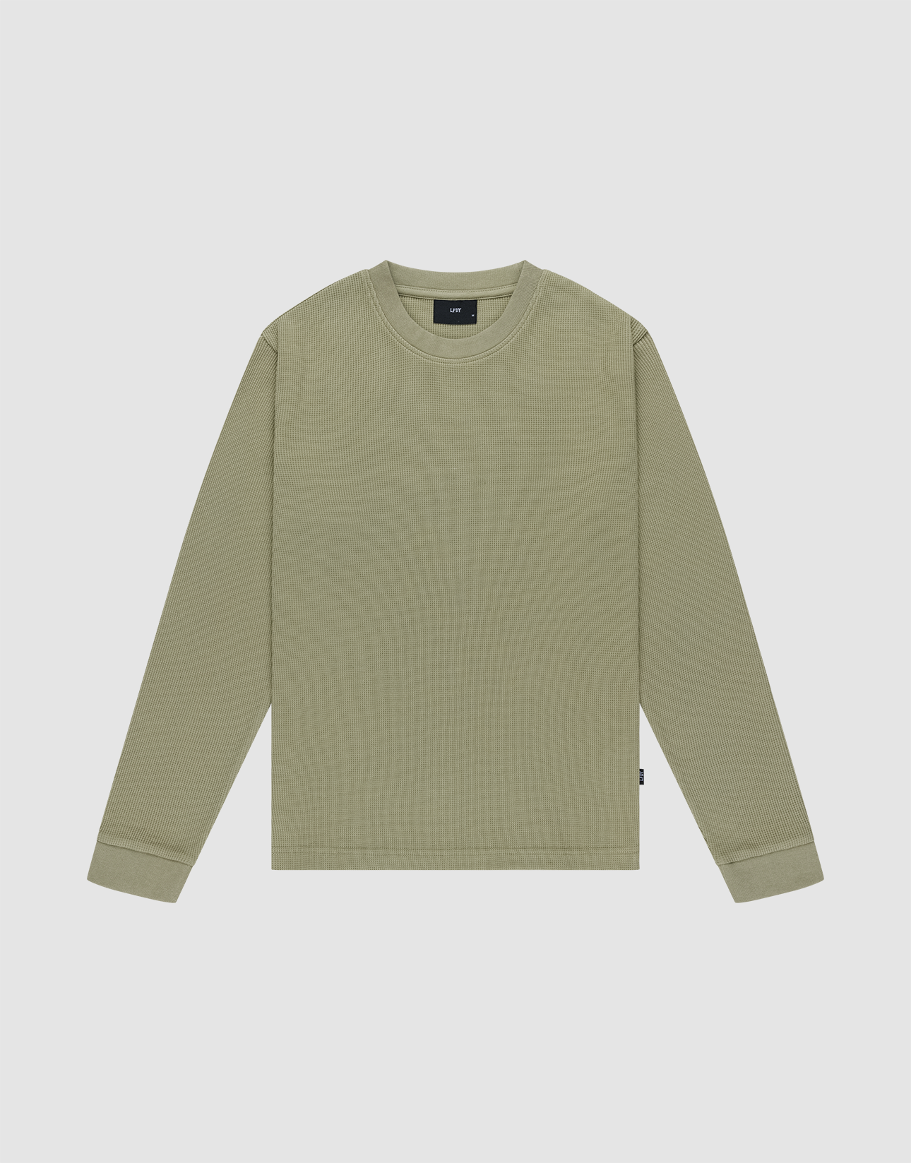 The Basic Waffle Longsleeve by LIVE FAST DIE YOUNG is a plain, light olive green, crew neck shirt with long sleeves made from soft Baumwolle, shown flat on a light gray background. | plain
