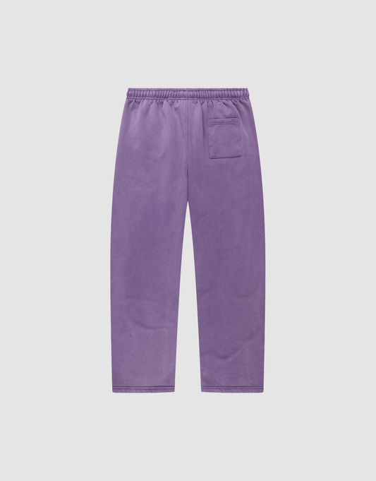 The LIVE FAST DIE YOUNG Basic Wide Jogger features a wide fit, elastic waistband, logo-print detail, and a single back pocket. Displayed flat on a plain white background.
