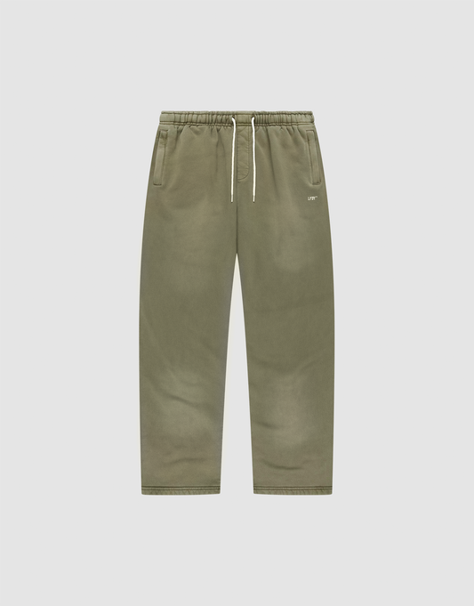 The Basic Wide Jogger by LIVE FAST DIE YOUNG features an olive green wide fit, elastic waistband, white drawstring, side pockets, and a minimal logo on the left pocket. Shown on a plain white background for a clean presentation. | plain